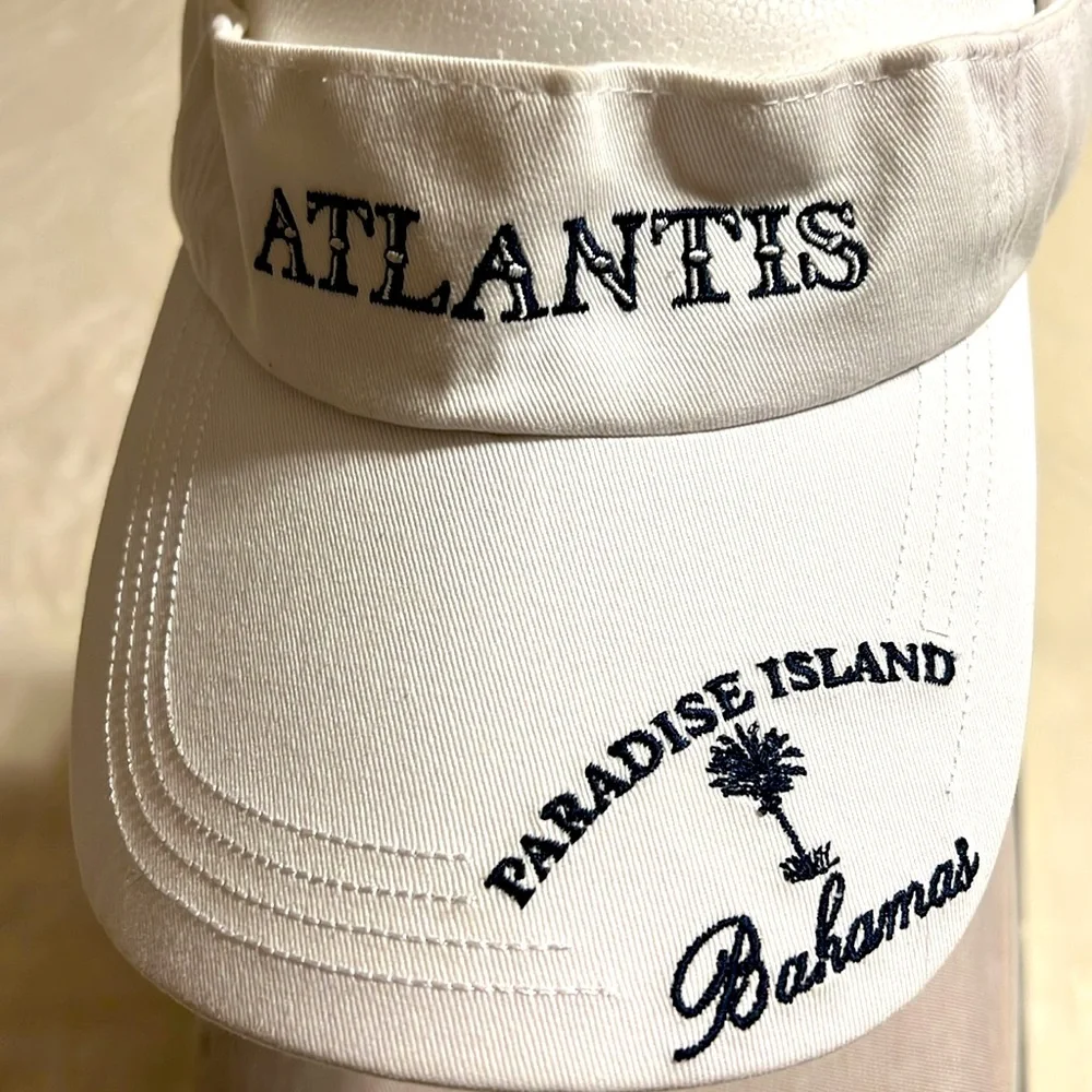 Atlantis. Paradise Island. White Atlantis Visor Hat. NWOT. One size fits all.